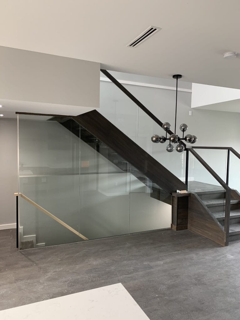 side view glass and wooden stairway